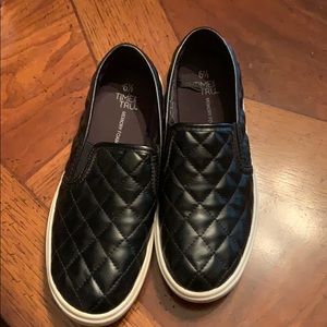 Slip on shoes slightly worn .